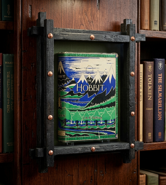Book titled 'The Hobbit' framed in a decorative wooden shelf with other books in the background.