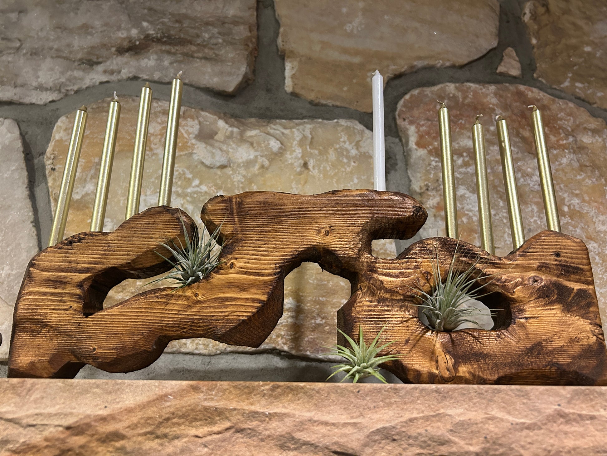 Menorah Sculpture Against Stone Background